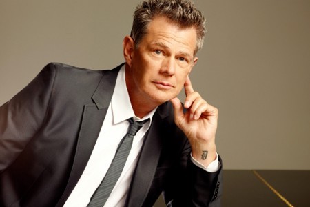 An image of David Foster in a suit and a tie.