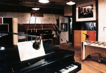 An old image of the Motown recording studio in Detroit with a piano in the front of the picture.