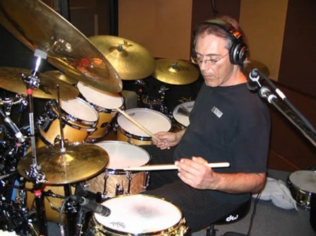 An image of Vinnie Colaiuta on a drumset as one of the Musical Influences and Inspirations