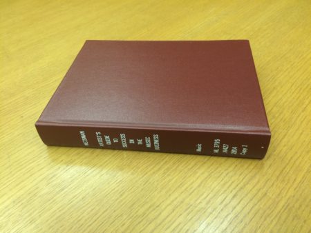 leather bound book on a tan table