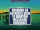A background of a blue and green hue sunset over a lake with a title in the center that reads branding an authentic book to maintain messaging endurance.