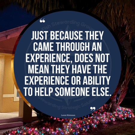 A background of a tan home with Christmas lights in the bushes and a blue circle with text in the middle that reads, Just because they came through an experience, does not mean they have the experience or ability to help someone else. 