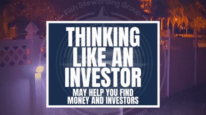 A featured graphic with a fence in the background at night with some lights illuminating it as well as a street light in the background with trees. Then, in the middle, a blue rectangle in the center with a white border around it with white text that reads Thinking like an investor may help you find money and investors. Above is the FSG Logo as well as a center text that reads Brand Messaging Strategist Loren Weisman. The blue rectangle is surrounded by a white Fish Stewarding Group logo watermark.