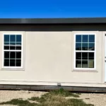 An outside front view of a MUPPS from FSG living buildings. This is a Tiny home and multi use portable panel structure from an Abilene Tiny Home Builder.